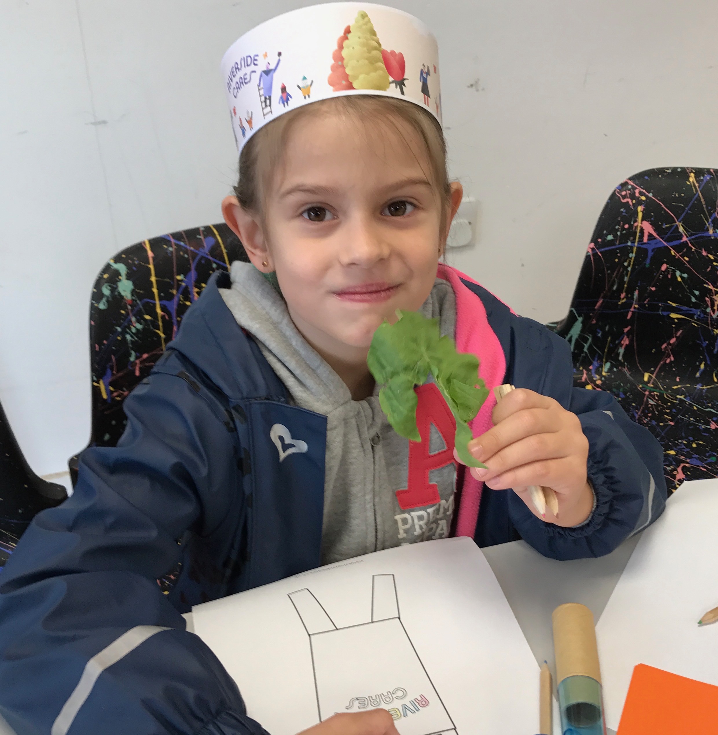 child holding sorrel leaf